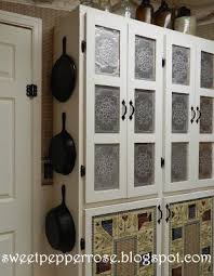Punched Tin Panels Http Www Sweetpepperrose Blogspot Com 2012 02 Punched Tin Paneled Country Cabinet Html Tin Panel Punched Tin Tin Backsplash Kitchen