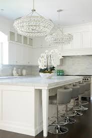 These drops create a decidedly appetizing sparkle that's ideal for modern dining rooms. Kitchen Island With Robert Abbey Bling Chandeliers Transitional Kitchen