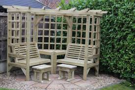 Our definition of an arbour is essentially a wooden garden bench seat with a roof, usually enclosed by trellis the size of the gaps in the latticework can make a difference if you're intending to cover the arbour with climbers. Clementine Corner Arbour 4 Seat Garden Arbour Wooden Pergola Seat