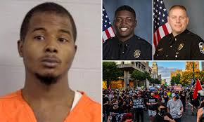 Man, 26, who is accused of shooting two Louisville officers is held