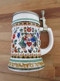 Your beer german mug stock images are ready. This German Beer Stein Or Mug Has Beautiful Folk Art Style Decorations On Each Side Showing A Man And Woman In Traditional Beer Steins Beer Trendy Party Decor