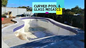 The inspiration for the design of this pool was the existing curved sandstone wall and how the landscaping would appear from the outdoor entertaining area that overlooks the backyard. Curved Pool Tiling Silver Ash Travertine With Glass Mosaic Waterline Timelapse Youtube