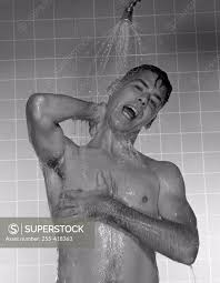 Naked man taking shower - SuperStock