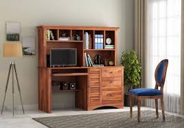 Wooden computer table design consist with cabinets and drawers to keep documents and necessities within access. Buy Jerold Study Table Honey Finish Online In India Wooden Street