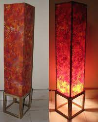 I cut gallon size plastic milk jugs into flowers and layered three of them per shade. Inexpensive Diy Floor Lamp Ideas To Make At Home