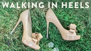 walking in grass wearing heels