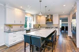 Black kitchen countertops white kitchen cabinets kitchen redo kitchen flooring new kitchen kitchen white kitchen backsplash kitchen with dark floors black counter white cabinets. Luxury Home Interior Boasts Beautiful Black And White Kitchen Stock Photo Picture And Royalty Free Image Image 93392369