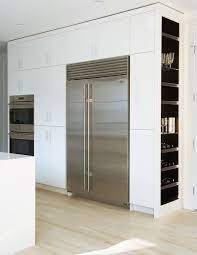 Discover everything about it here. Kitchen With Built In Wine Racks Modern Kitchen Modern Kitchen Design Kitchen Wall Cabinets Modern Kitchen