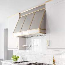 Touch Of Brass The Brass Hardware Trend Is Still Going Strong Kitchen Hoods Kitchen Range Hood Kitchen Hood Design
