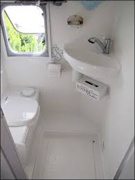 Wet versus dry bathrooms in a small camping trailer. Http Home Sweet Motorhome Blogspot Co Uk Camper Bathroom Rv Bathroom Remodeled Campers