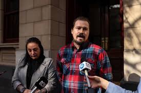 STEVEN JOHNSON COURT, Christopher Jarviss son Cale Jarvis (left) departs  from the Supreme Court of