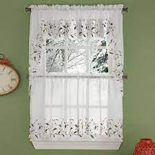 Think of a swag as a valance with wings. Holly Cutwork Semi Sheer Kitchen Valance Swags And Tier Curtains