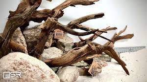 The stones are primarily charcoal colored with common characteristics that include white marbling, grooves, and jagged edges. Sr Aquaristik On Twitter Whatever Your Hardscape Vision Is Use The Same Types Of Rock Wood Throughout The Scene To Create A More Natural Looking Scape Weathered Driftwood Tan Elephant