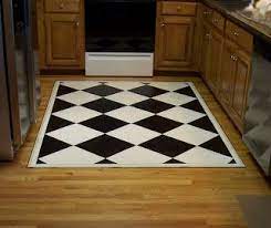 Here's the one i made for the entryway (it's 4 feet by 2 feet, if you were wondering): How To Make A Custom Painted Floor Cloth From A Sheet Of Vinyl Flooring Floor Cloth Painted Floor Cloths Vinyl Flooring