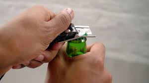 Position the spoon under the lip of the cap and, using the base of your thumb as leverage, pry the cap loose. 3 Ways To Open A Bottle Without A Bottle Opener Wikihow