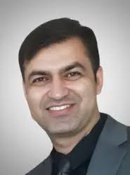 Dr. Karan Doomra, DDS