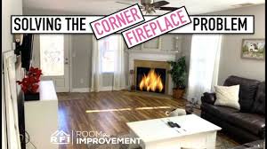 The open plan living, walls of custom joinery, fireplace, high overhead windows, and floor to ceiling glass sliders all pay respect to successful and appropriate techniques of modernity. Corner Fireplace Living Room Redesign Design Time Youtube