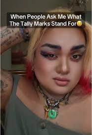 Tally Marks Between Shoulders