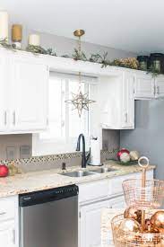 The first photo was taken during christmas 2002 and features the pine garland. Christmas Kitchen Home Tour Refashionably Late