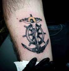 The design shows an anchor which is chained with a cross, with lovely shades in darkish black. Pin On Tattoo Men Design Ideas