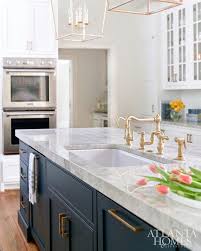 Love The Ovens Stacked On Top Of Each Other And The Dark Grey Blue Cabinets Contrasted With Kitchen Remodel Small White Kitchen Remodeling Kitchen Renovation