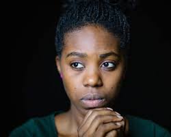 How can Justina get financial assistance for her PhD research