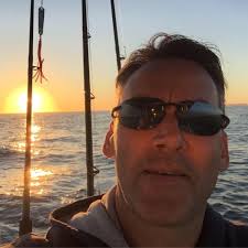 Crossing the stream to Hole in the Wall with water shoes