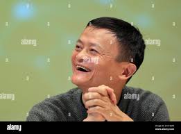 Jack Ma, executive chairman of the Alibaba Group, smiles druing a press  conference with the Pac-12 in Hangzhou in eastern China's Zhejiang province  Tuesday, Nov. 10, 2015. (AP Photo Stock Photo