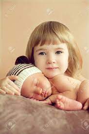 Maybe you would like to learn more about one of these? Little Girl Hugging Her Newborn Sleeping Brother Good Morning In A Happy Family For The Love Of Children To Their Brothers And Sisters Stock Photo Picture And Royalty Free Image Image 66111756