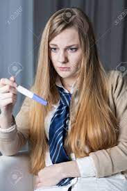 Young Terrified Pregnant Girl Not Ready To Be A Mother. Holding Positive  Pregnancy Test Stock Photo, Picture and Royalty Free Image. Image 54189721.