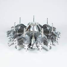 The coffee table has been built with the propeller shaft extending through the middle at the top, and it has a glass surface mounted to alloy legs that attach to the cylinder heads. Continental Radial Engine Coffee Table For Sale At 1stdibs