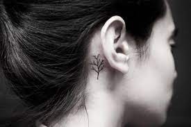 A Small Black Tree Tattoo Inked Behind The Right Ear Ear Tattoo Small Tattoos Tattoo Behind The Ear