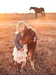 Add a dynamic caption to complete the memory. My Family S Newborn Mini Horse And Cute Little Girl Pose For Photo Shoot Result Adorable Imgur
