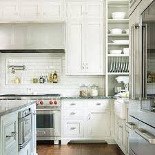 Bright and open design informs this kitchen, flush with white cabinetry and uba tuba counters. Ubatuba Granite Counters Design Ideas