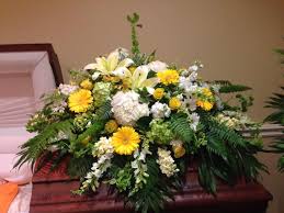 Choose from our carefully selected range of classically beautiful funeral flowers and just let us know where we need to. Yellow And White Remembrance Casket Flowers Main Florist