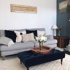 Grey Sofa Cream Carpet White And Blue Walls And A Blue Velvet Foot Stool In The Living Room Livingro Blue Living Room Living Room Grey Grey Sofa Living Room