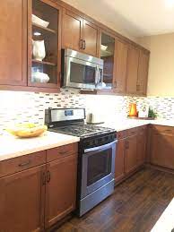 The new kitchen before after slate kitchen kitchen floor tile. Medium Brown Kitchen Cabinets W Light Quartz Countertop And Mosa Kitchen Ideas Medium Brown Cabinets Brown Kitchen Cabinets Kitchen Ideas Light Brown Cabinets