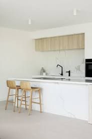 Though this kitchen's range and cabinets are both white, one has brass. Best 60 Modern Kitchen White Cabinets Ceramic Tile Floors Design Dwell