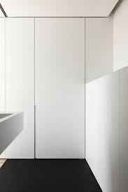 You know, so it looks like its part of the wall, but its a door? Frameless Swing Doors Insensation New York Frameless Doors Pivot Entry Doors Minimalist Doors Insensation Is The Ferrari Of Frameless Doors Luxury Home Builder