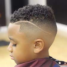Short Curly Hair With Shaved Sides And Design Boys Fade Haircut Boy Hairstyles Black Boys Haircuts