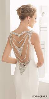 This flattering neckline elongates the neck and accentuates the bust. Rosa Clara 2017 Bridal Collection These Wedding Dresses Feature Unforgettable Details Wedding Inspirasi Column Wedding Dress Wedding Dresses Beaded Crepe Wedding Dress