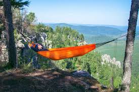 Tuck the ends of the rope through the portable hammock's end loops, and secure the rope ends with a knot. 21 Expert Hammock Camping Tips To Keep You Comfy All Night