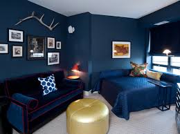 The navy blue paint on the accent wall of this bedroom creates a bold statement while making the white ceiling look more crisp. 20 Beautiful Bedroom Designs With Gold And Navy Accents Home Design Lover