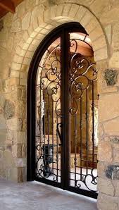 Wrought iron interior doors work throughout your home's entryway and aisle. Spanish Iron Gates