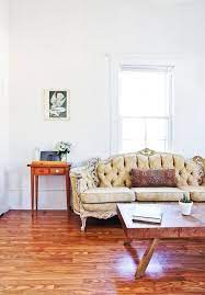 Large living room featuring beige walls and carpet flooring topped by a classy rug. 9 Rugless Rooms That Rock Apartment Therapy