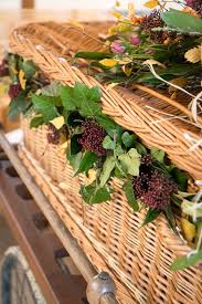 The apprentice sven flader puts flowers on a coffin, at an undertaker in duesseldorf, germany, 15 august 2003. Clare Kenward Flowers Sympathy Flowers Contemporary Cambridge Florist