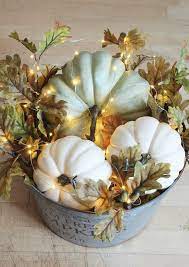 This diy lighted pumpkin basket can be put together in less than 10 minutes and adds such a pretty glow to your fall decor! Diy Lighted Pumpkin Basket Galvanized Metal Bucket Filled With Pumpkins Fall Leaves And Mi Fall Thanksgiving Decor Fall Halloween Decor Farmhouse Fall Decor