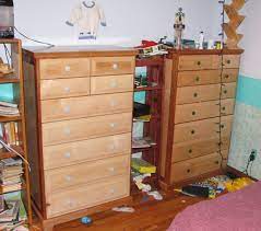 Long dresser with mirror.in one picture it is just sitting behind dresser and not attached to dresser tall dresser two night tables drawers work a bed set with an expandable steel frame to double and queen size which is in a very good condition except minor dents from moving. Tall Dresser