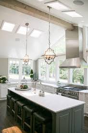 White And Gray Kitchen Features A Vaulted Ceiling Accented With Beadboard Trim Accented With Sky Vaulted Ceiling Kitchen Home Decor Kitchen Dining Room Remodel
