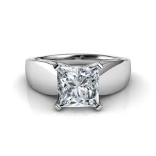 Completely contemporary, yet stunningly timeless, this beautiful square cut diamond engagement ring is a classic choice that places the diamond centre stage. Wide Band Princess Cut Diamond Engagement Ring Natalie Diamonds